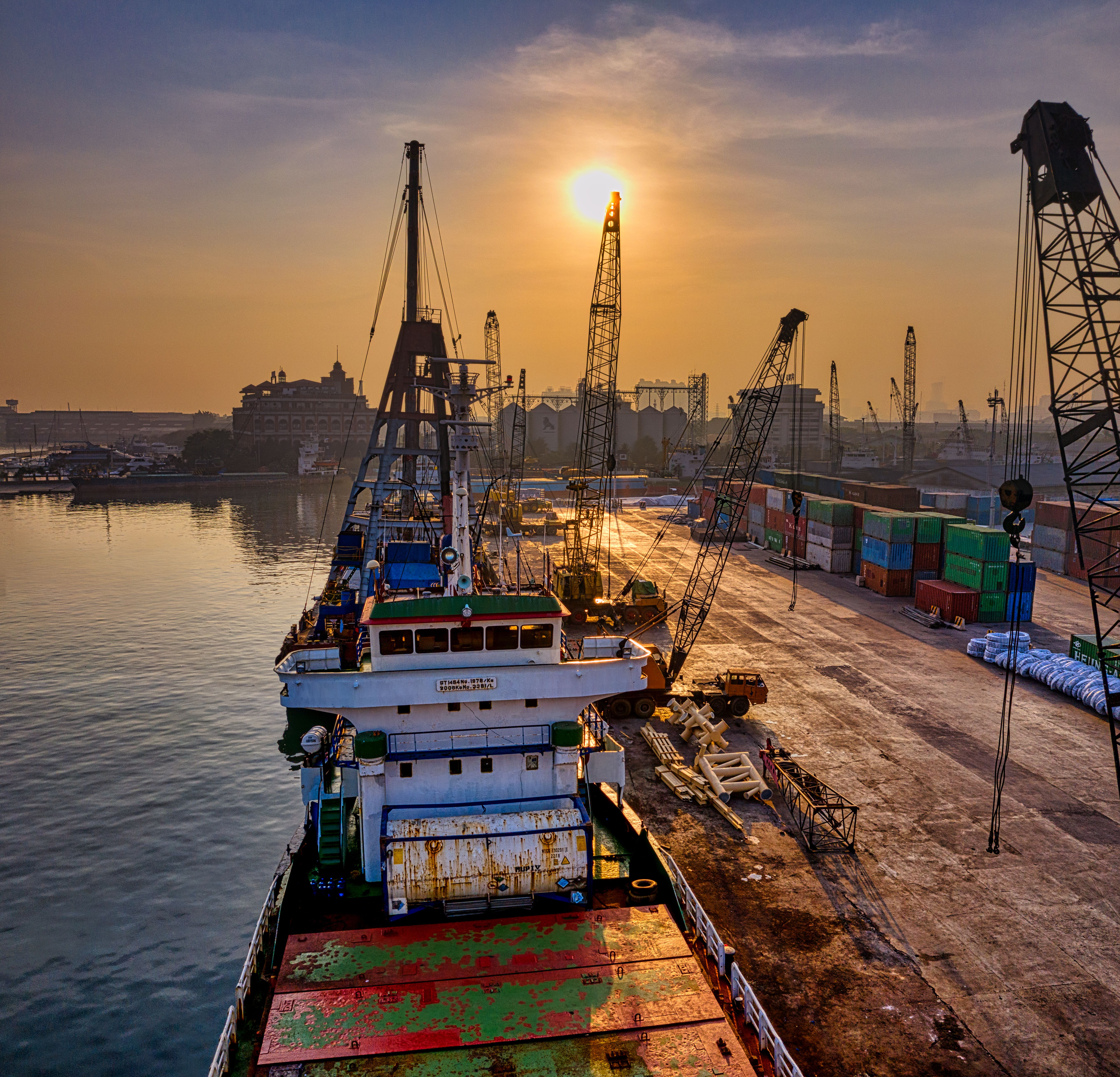 Cargo operations at a busy Indonesian port representing Asian trade links