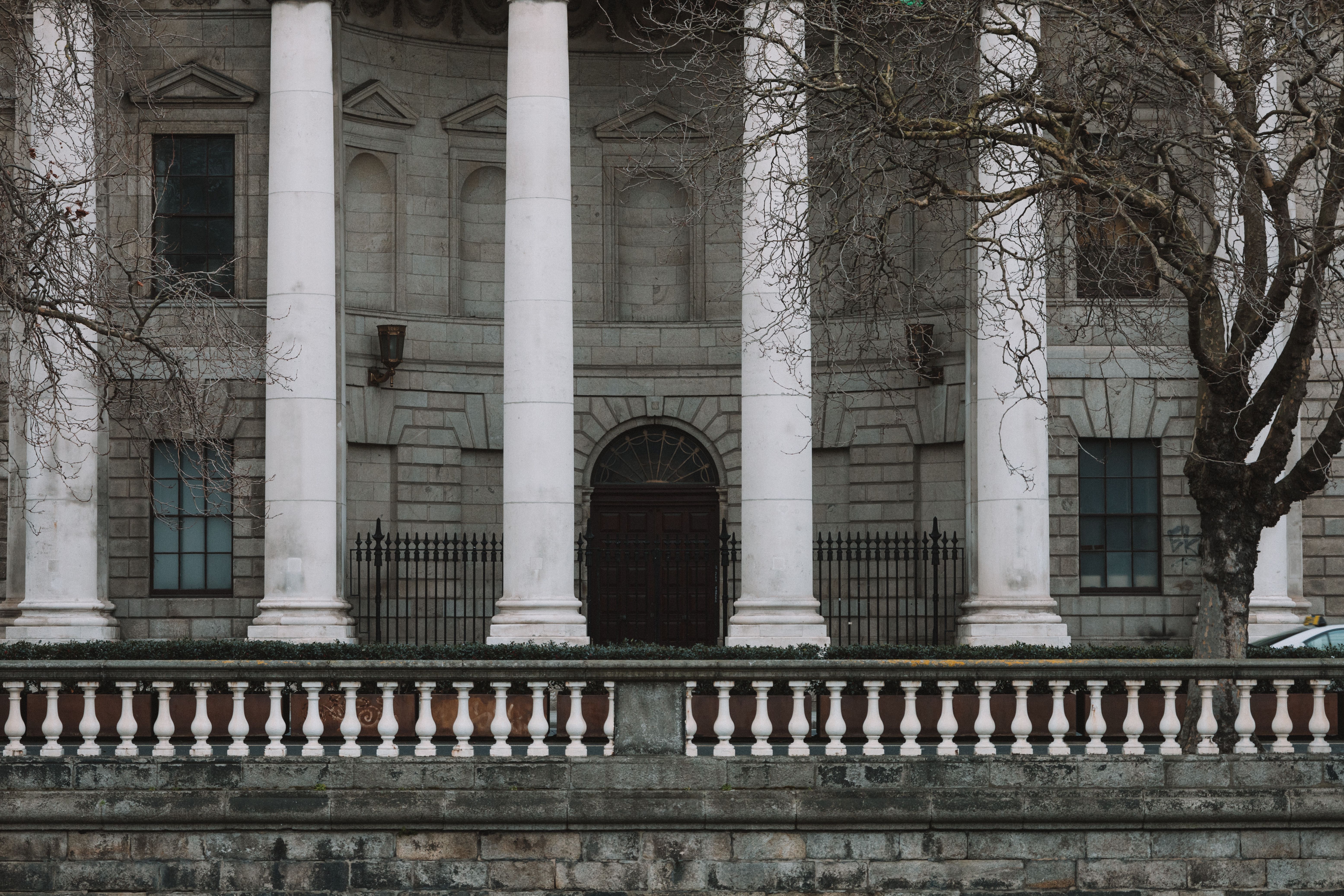 Neoclassical courthouse facade with columns, representing the courts where cross-border class actions are heard