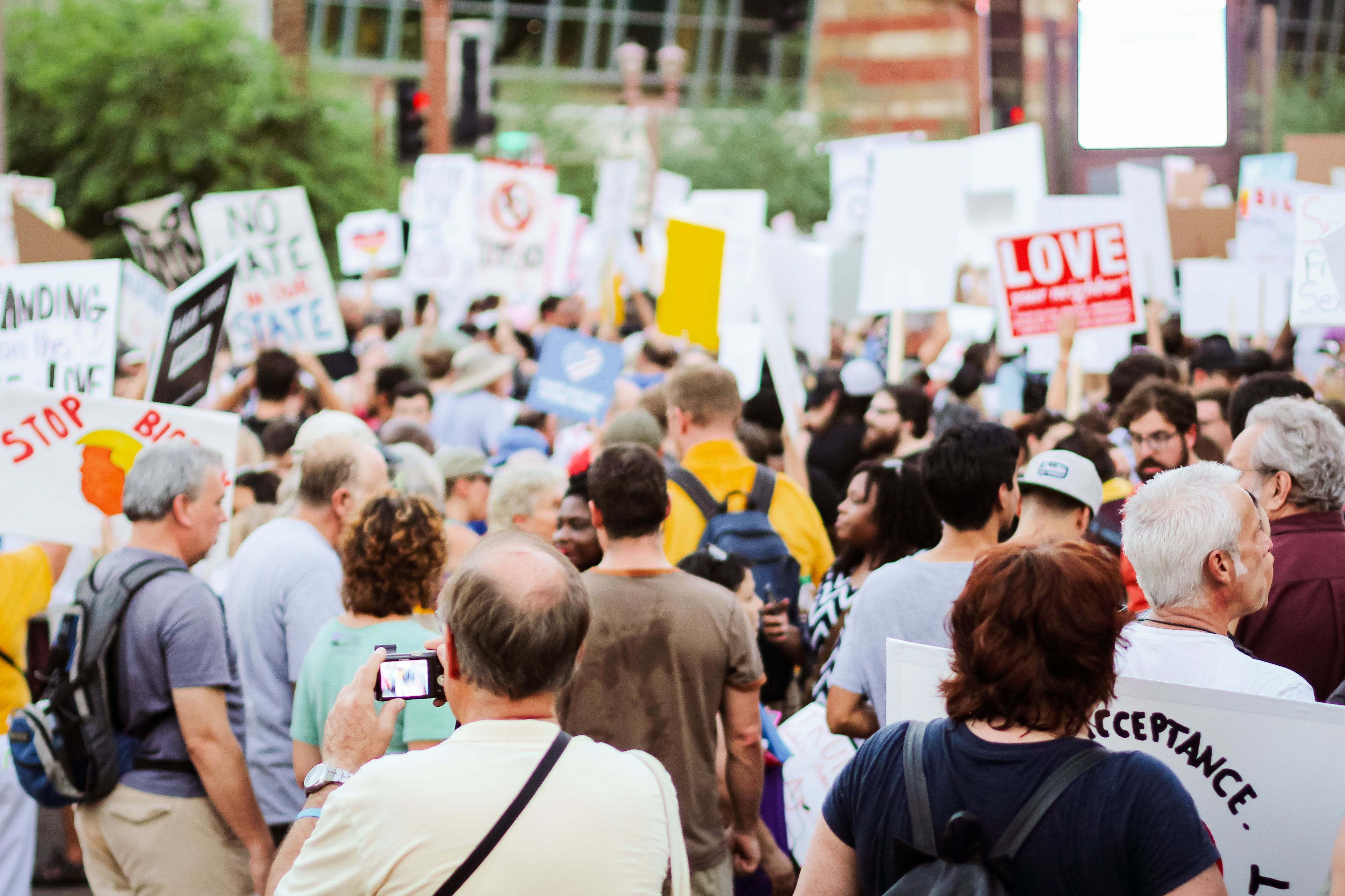 Large crowd of people gathered together, representing a group of claimants forming a class action